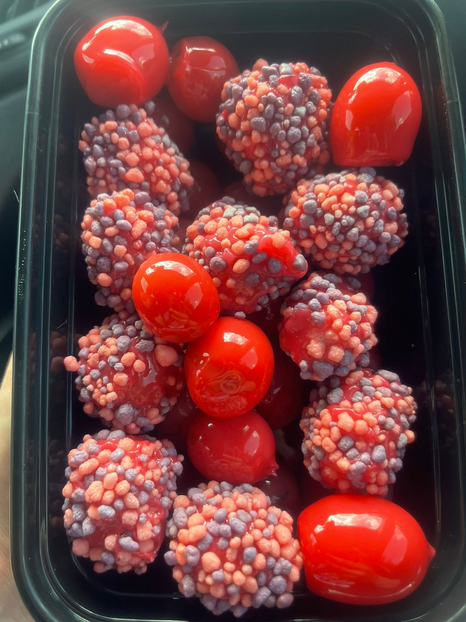Red candied grapes and crunchy candy-coated fruit tray